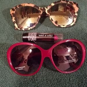 2 pr sunglasses with a pink lip stick